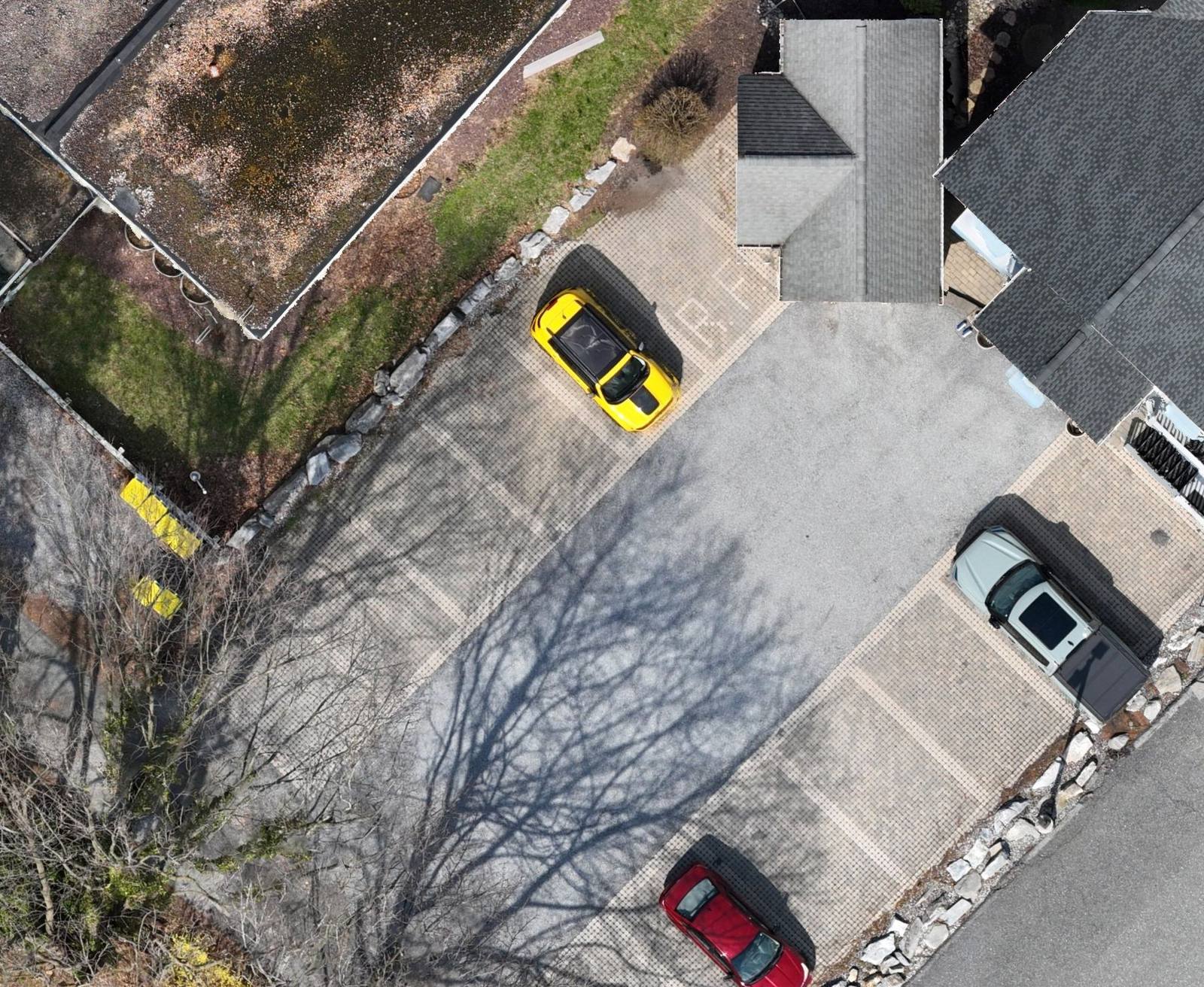 Full-resolution drone orthomosaic detail of R.J. Fisher & Associates' New Cumberland office lot — individual vehicles and parking-lot striping are clearly visible
